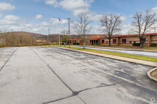 Mendon Elementary School has a large parking lot that has easy access to the school.