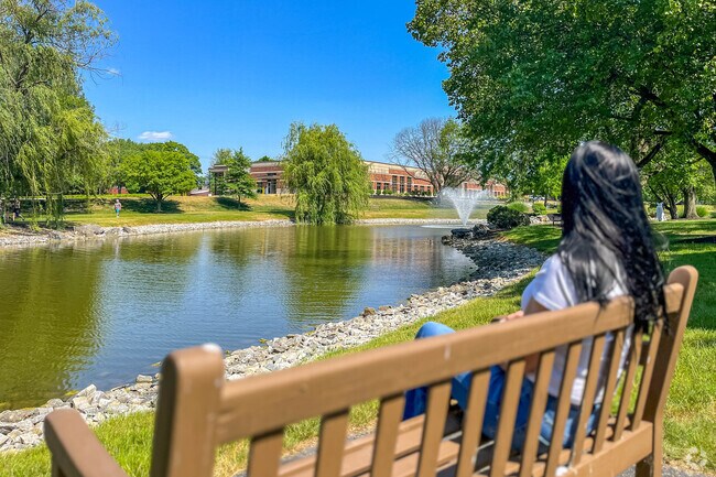 Greenfield Park in Witmer has benches, and a large lake with a fountain at its center.