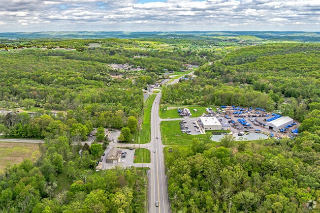 This scenic corridor weaves through a lush, expansive valley, connecting charming small businesses with peaceful rural living in every direction.