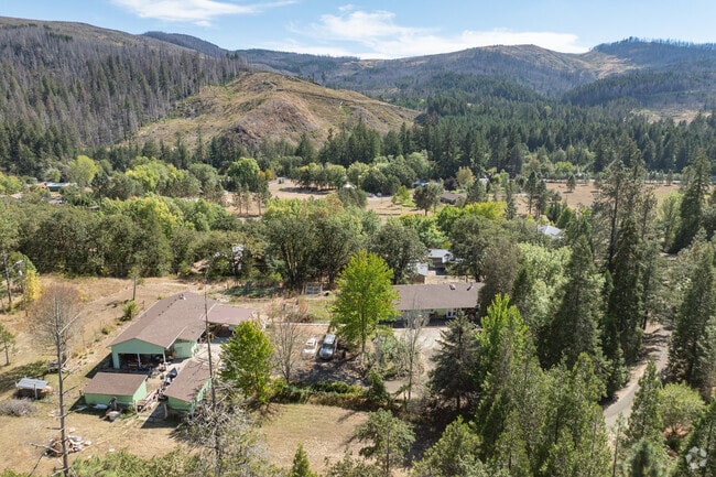 Mature forest parcels with homes are also common in Glide.