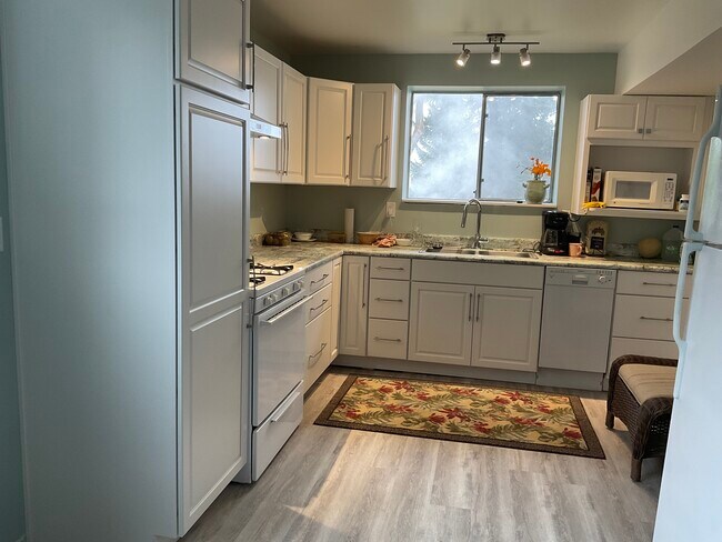 Fully equipped new kitchen , Dishwasher, Gas cooking, Large new Microwave/ Oven fan/ garbage disp.