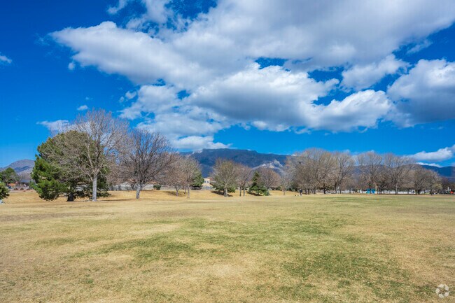 Heritage Hills Park features a large grass field with great views of the Sandia Mountains.