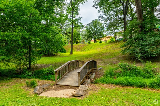 You'll find a quiet bridge over a natural creek adds a touch of tranquility and charm to Knight Park.