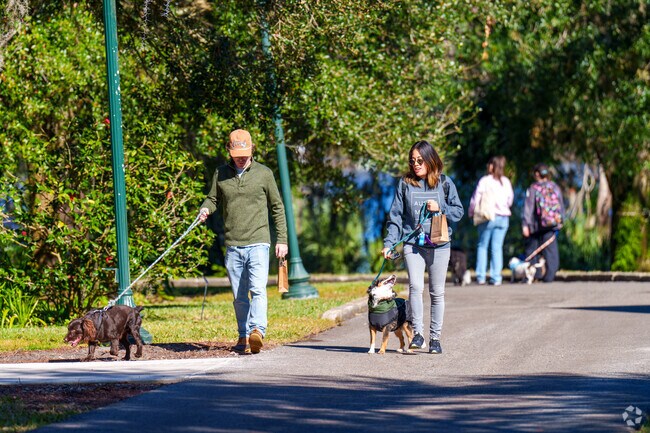 Winter Park residents enjoy walking their dogs through Leu Gardens on Dog Day.