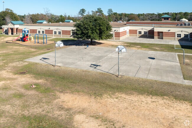 The kids can play basketball, play on the playground, or play tag in the fields during recess.