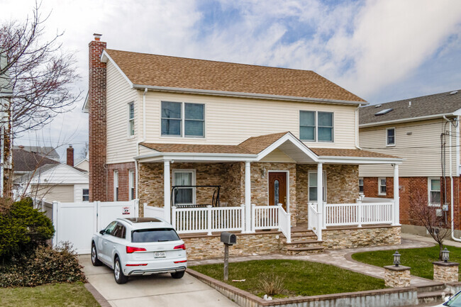 Here is a colonial Revival with side a Gabled roof in West Hempstead.