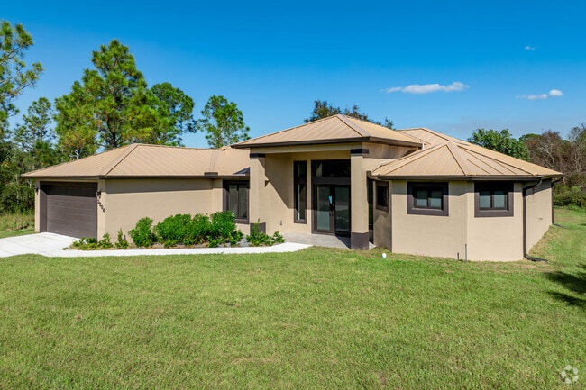 Mature trees line the streets and yards of the Harris neighborhood.