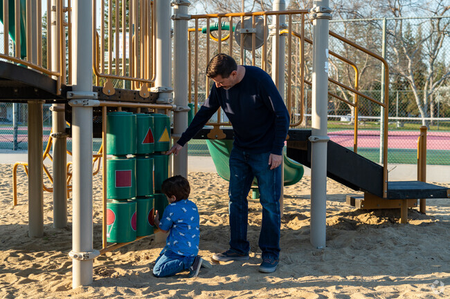 Father and son enjoy at game of tic tack toe at Haggin Oaks Park.