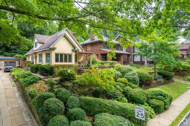 Edgewood is covered in mature trees and greenery, offering shade to many of the homes.