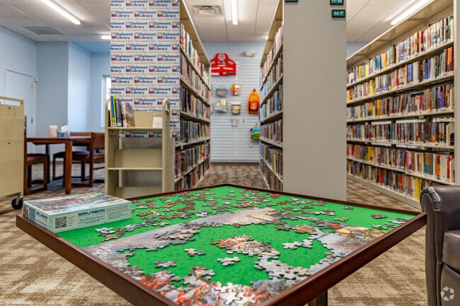 The Delmont Public Library boasts an outdoor garden and a children's section.