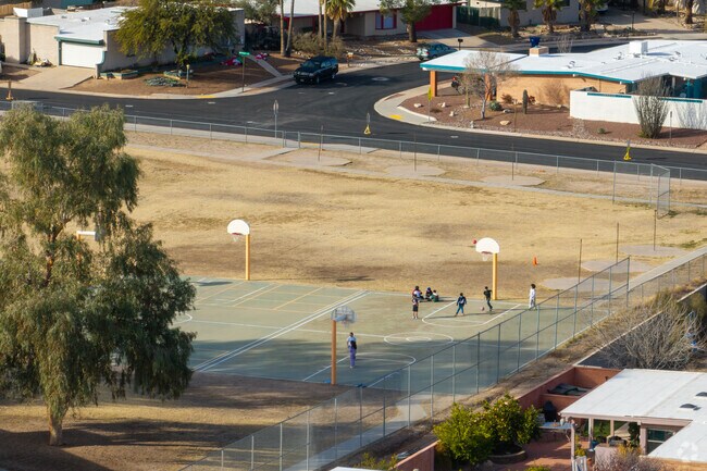Gale Elementary School has a large field with various activity areas.