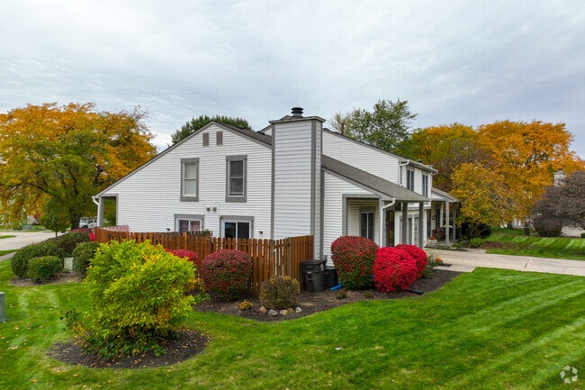 Colorful bushes and gardens surrounding the homes in Sawmill Woods.