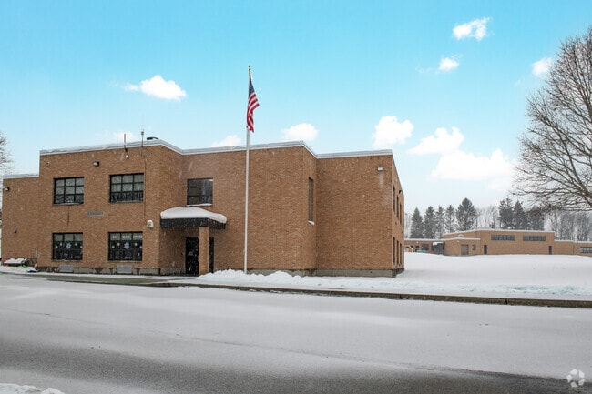 With 2 main entrances, children who arrive via bus enter Robert H. Jackson Elementary School through the lower level.