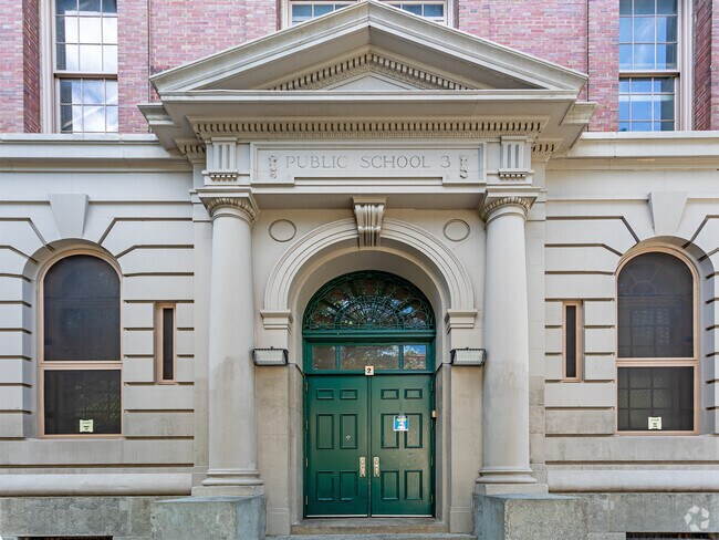 PS 3 Charrette School entrance had double doors leading to the main hallway for classrooms.