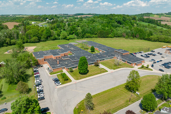 Memorial Park Elementary is surrounded by trees on all sides.