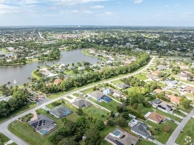 Aerial views of Paar Estates reveal spacious homes and lush greenery.