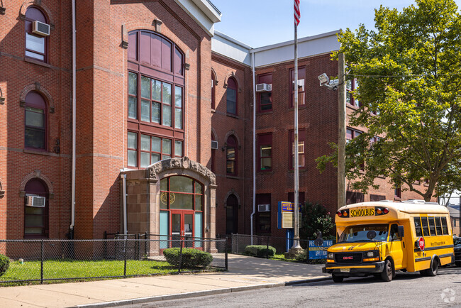 The alumni from Sir Isaac Newton Elementary School are proud of their education.