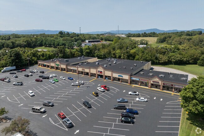 Orange plaza features a mix of retail stores, restaurants, and service providers.
