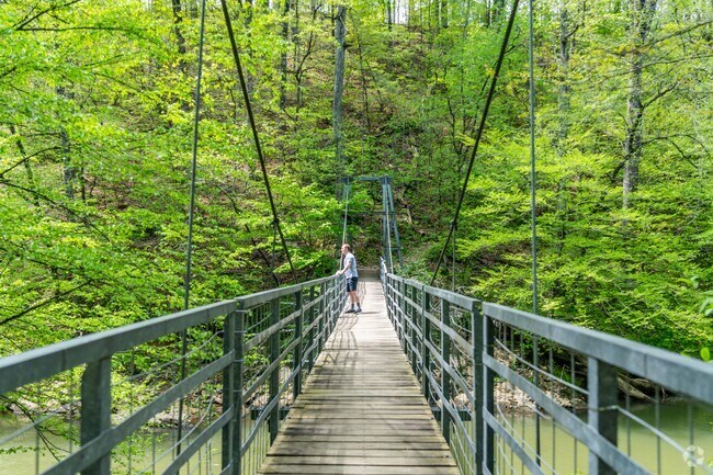 A swinging bridge at Audubon Acres spans South Chickamauga Creek.