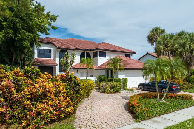 Villas in Boca West are often well maintained, and have lush front yards.