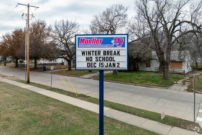There is a sign near the road for Mueller Aerospace and Engineering Magnet Elementary School.