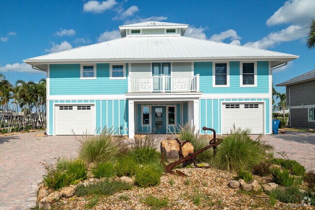 Large raised duplex home on the finger isles of San Carlos.