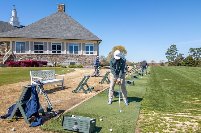 Watch the golfers from the driving range at Cedarwood Country Club near Olde Providence South.
