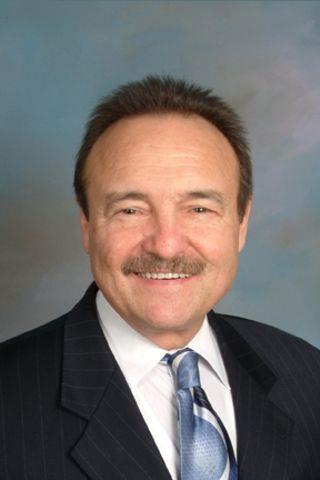 DENNIS BREZA