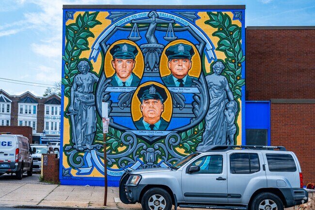 Vibrant mural art on the outside of the local Fern Rock, Philadelphia police station.