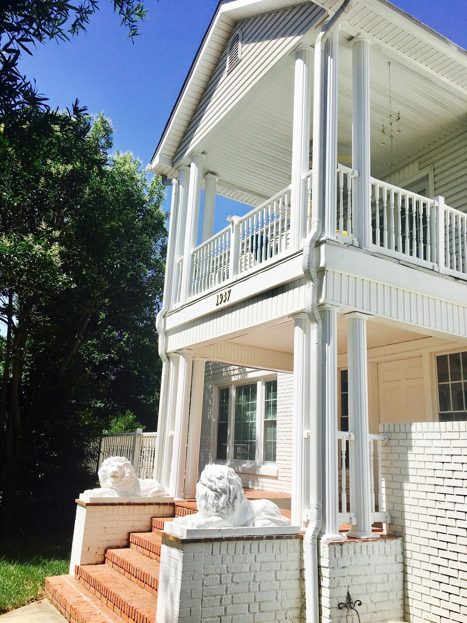 Restored 1937 home in Five Points, surrounded by trees and timeless Southern charm.