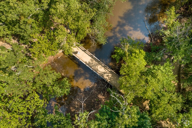 Spring Creek's Martin Park has a small creek with a bridge connecting both sides.