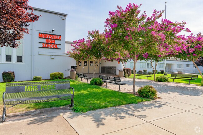 Marysville High School has benches and signs welcoming locals to the campus.