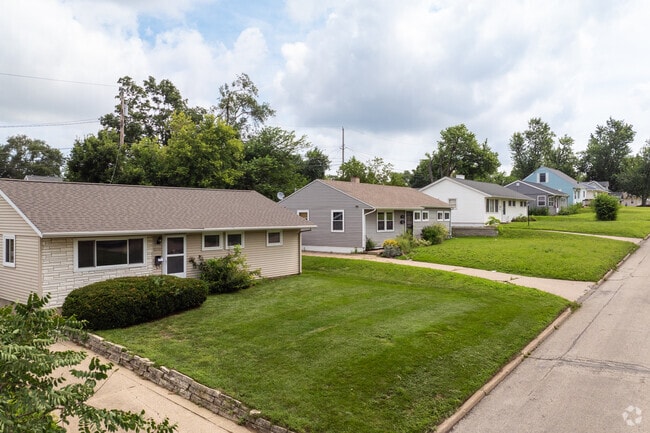 Ranch-style homes in Noelridge Park feature manicured lawns and spacious driveways.