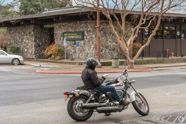 A man takes a break from riding through the Rheem Valley on his 1990s Honda Shadow.