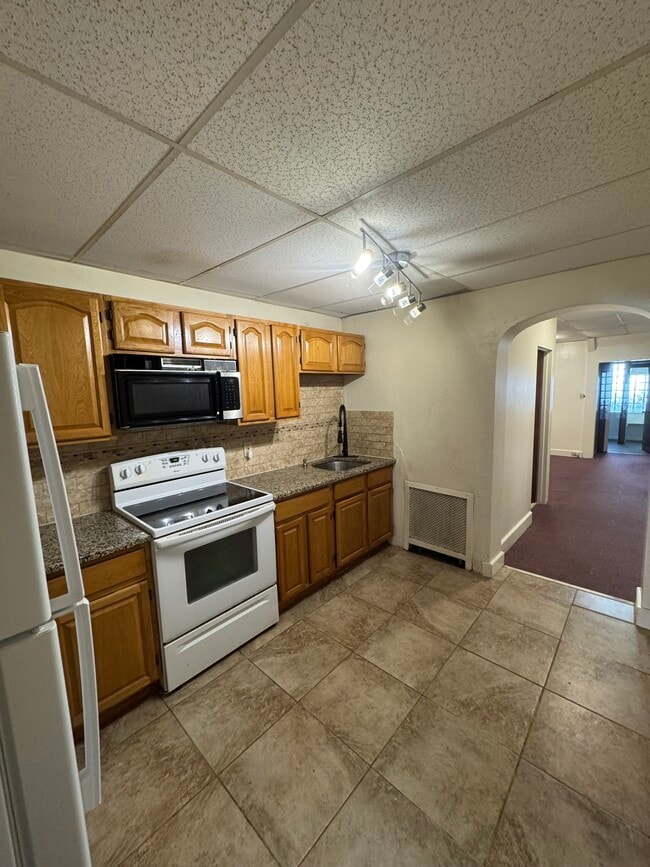 Kitchen showing hallway