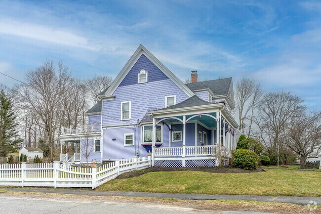 This stunning purple victorian shows off its picturesque white picket fence in Abington.