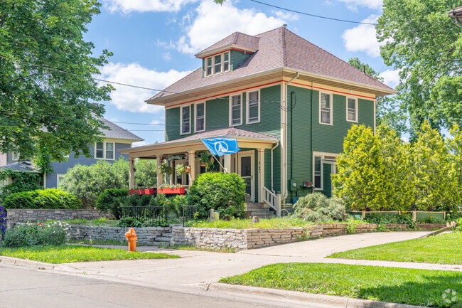 A green four square house in the Kutzky Park neighborhood.