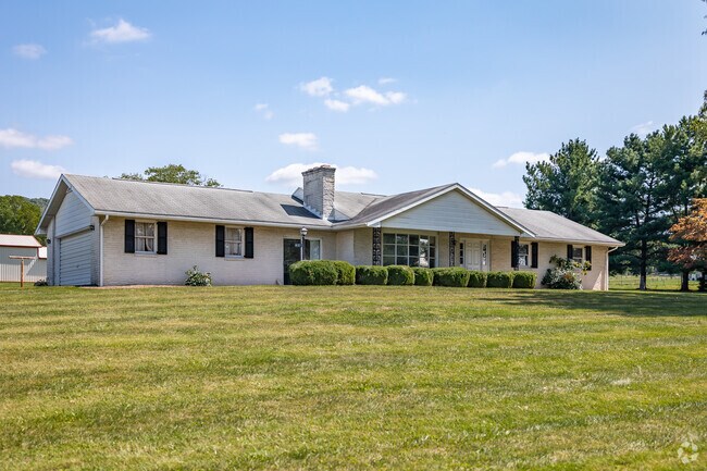 A spacious ranch style home one a massive lot in Mapleville.