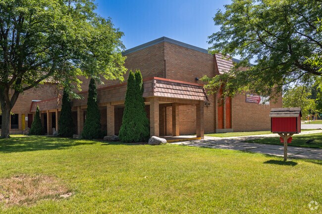 Trees and green space surround Blakewood School in Drexel Highlands.