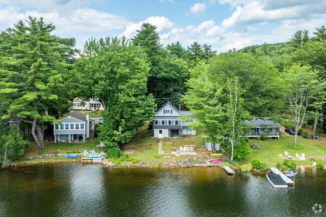 A row of homes with private lake access sits along Sawyer Lake.
