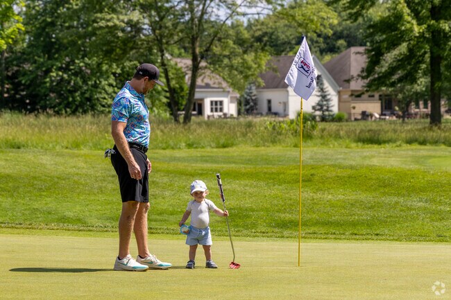 This Hamilton Township Dad and Son are having a great time at TPC River's Bend.