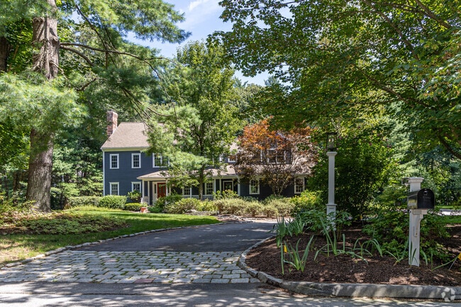 Colonial Revival home with private driveway for sale in the Wayland neighborhood.