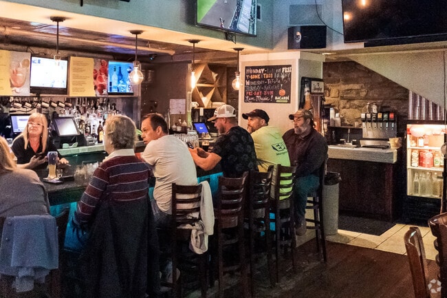 the conversation flows as easily as the drinks. A bar where community stories are shared, game nights are cheered, and neighbors feel like old friends.