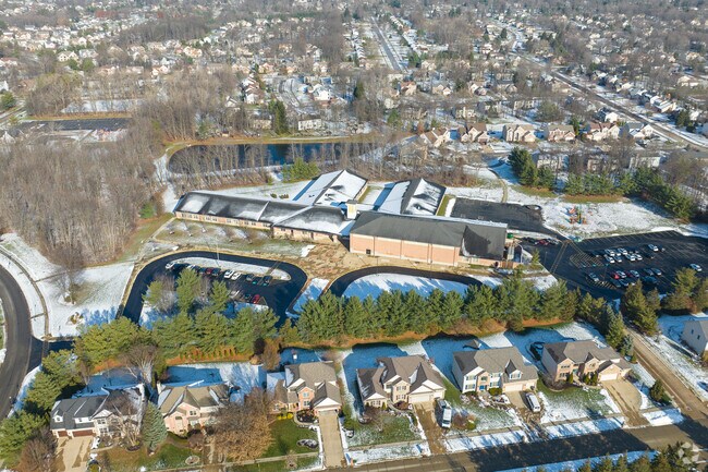 Aerial view of Kinsner Elementary School in Strongville among beautiful homes.