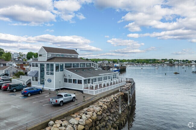 Enjoy a drink with friends as you watch boats come and go from Scituate Harbor.