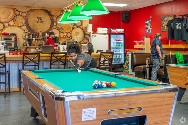 Boaz WV, residents can enjoy a game of pool at Down the Hatch .