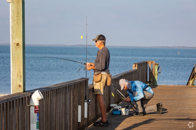 Two gentleman enjoying a day of fishing at Rockport Beach.
