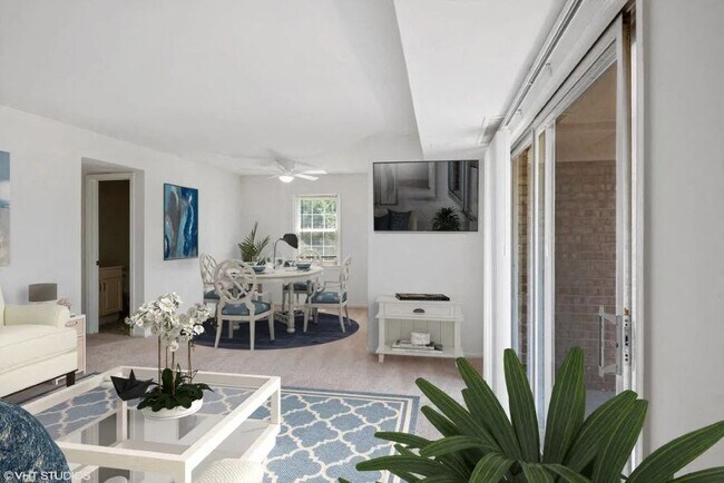 Bright living space with ceiling fan