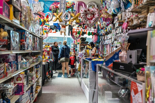 Family waiting to buy a piñata adding festive joy to their day near Portola Highlands.