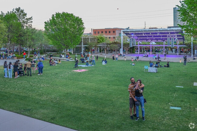 The Guthrie Green near Charles Page bustles with activity on warm weekend days.